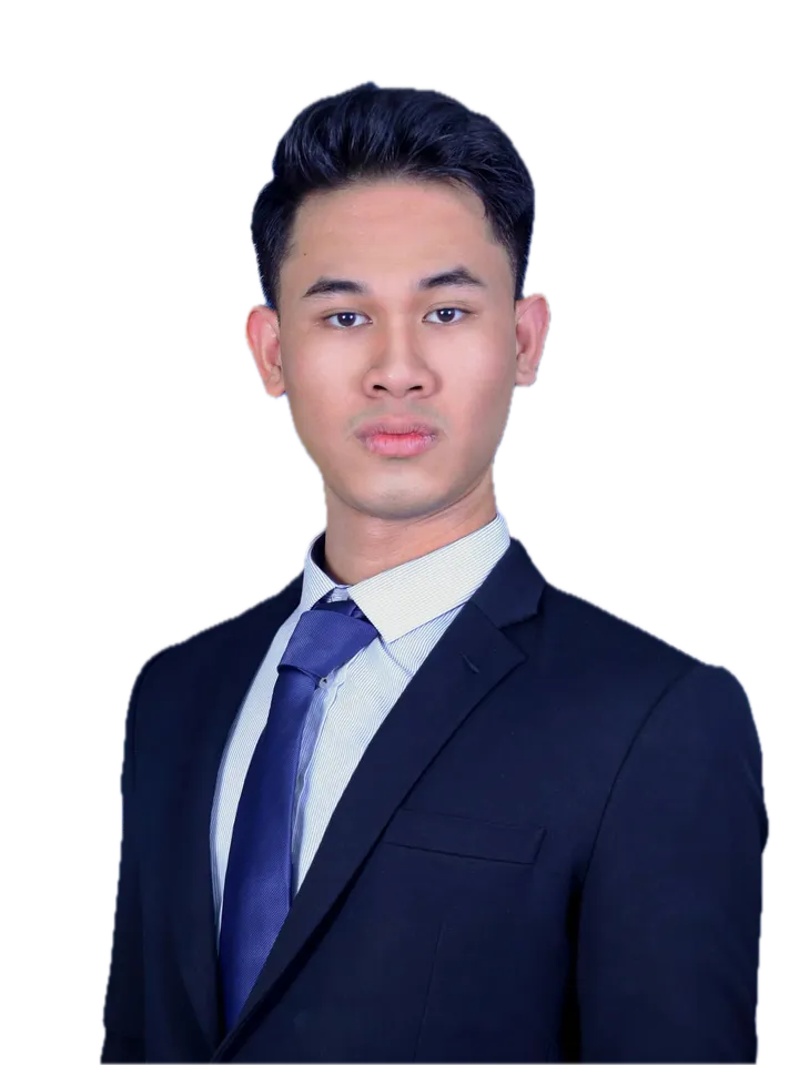 Gading Aditya Perdana in a navy suit and blue tie